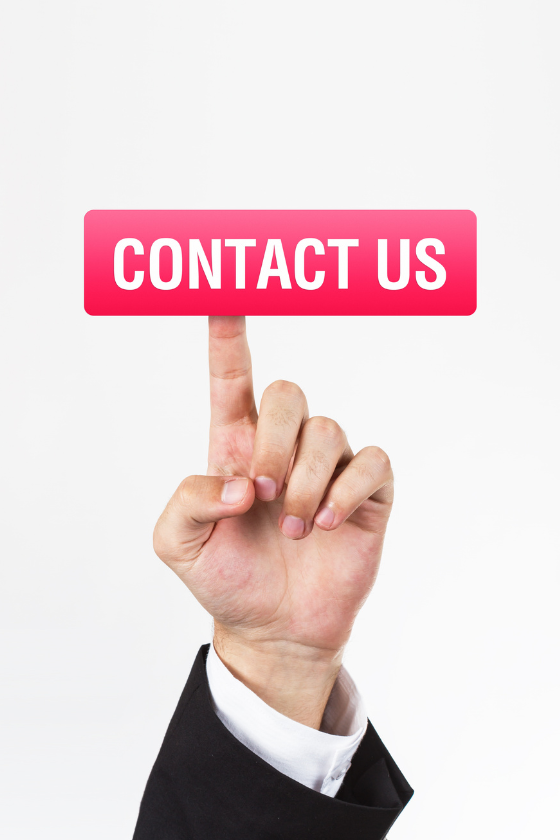 A hand is pressing a button that says contact us