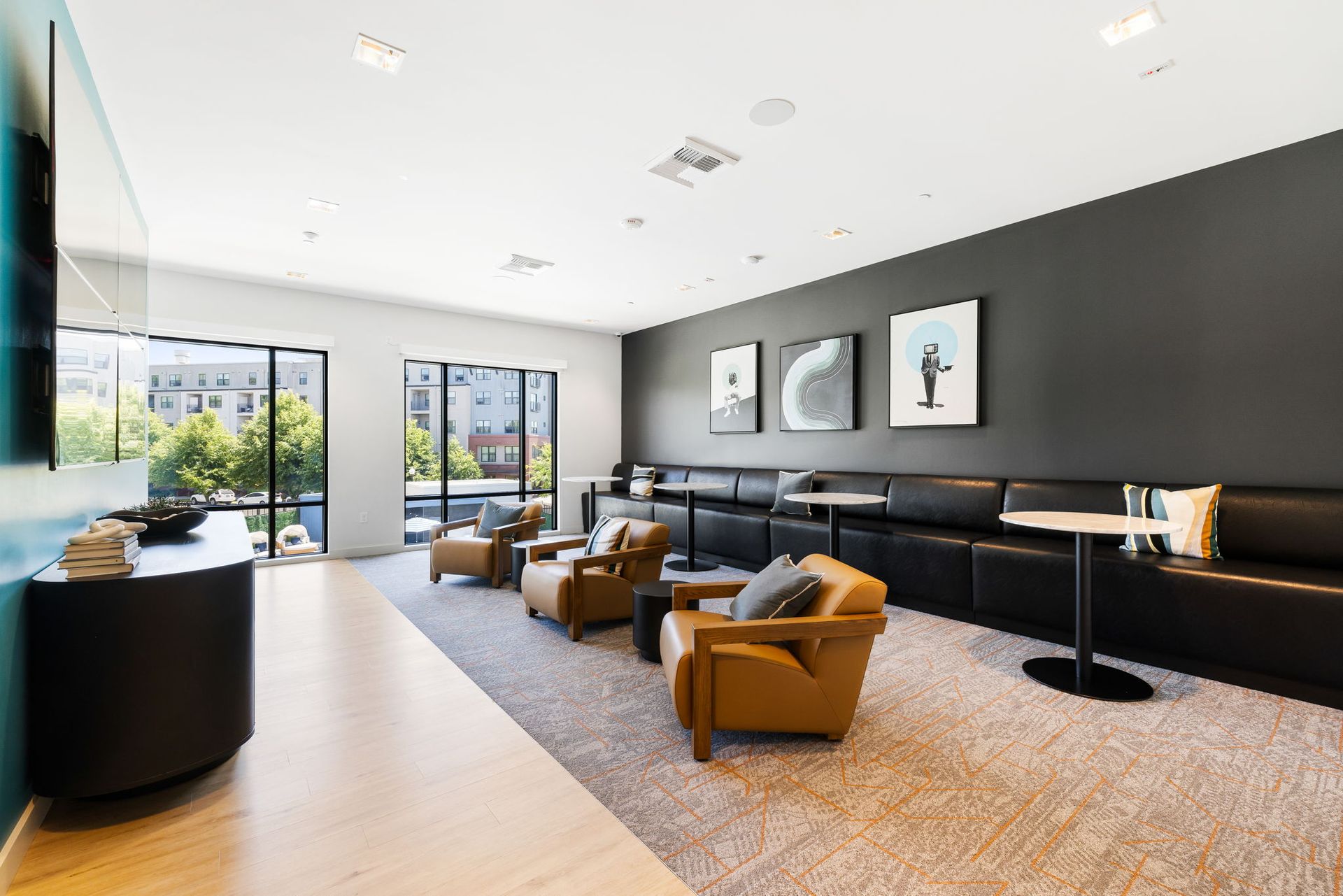 A resident area with a lot of furniture and a large window.