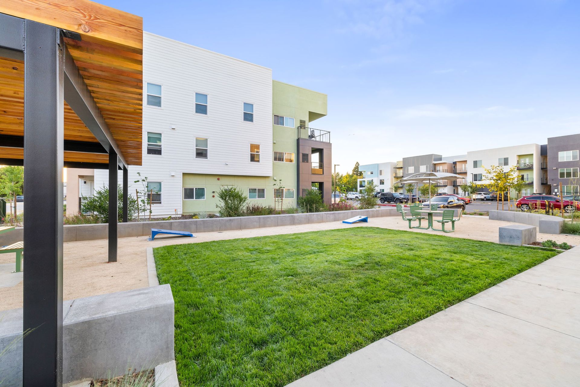 A large grassy area in front of a building