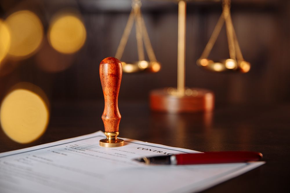 Notary's public pen and stamp on a contract. Notary public tools - Lawyer in Woy Woy, NSW