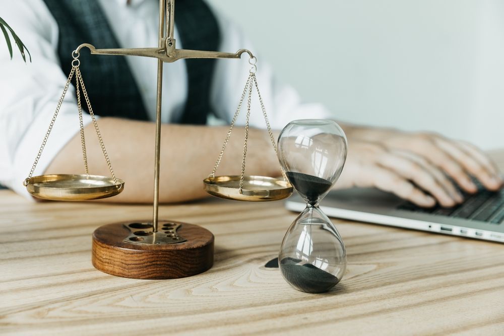Male lawyer working with contract papers and wooden gavel - Lawyer in Woy Woy, NSW