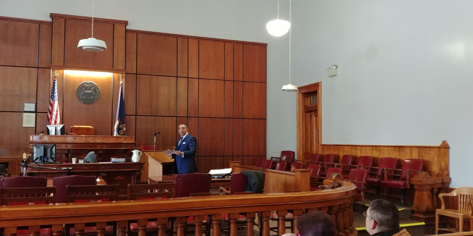 A man is giving a speech in a courtroom
