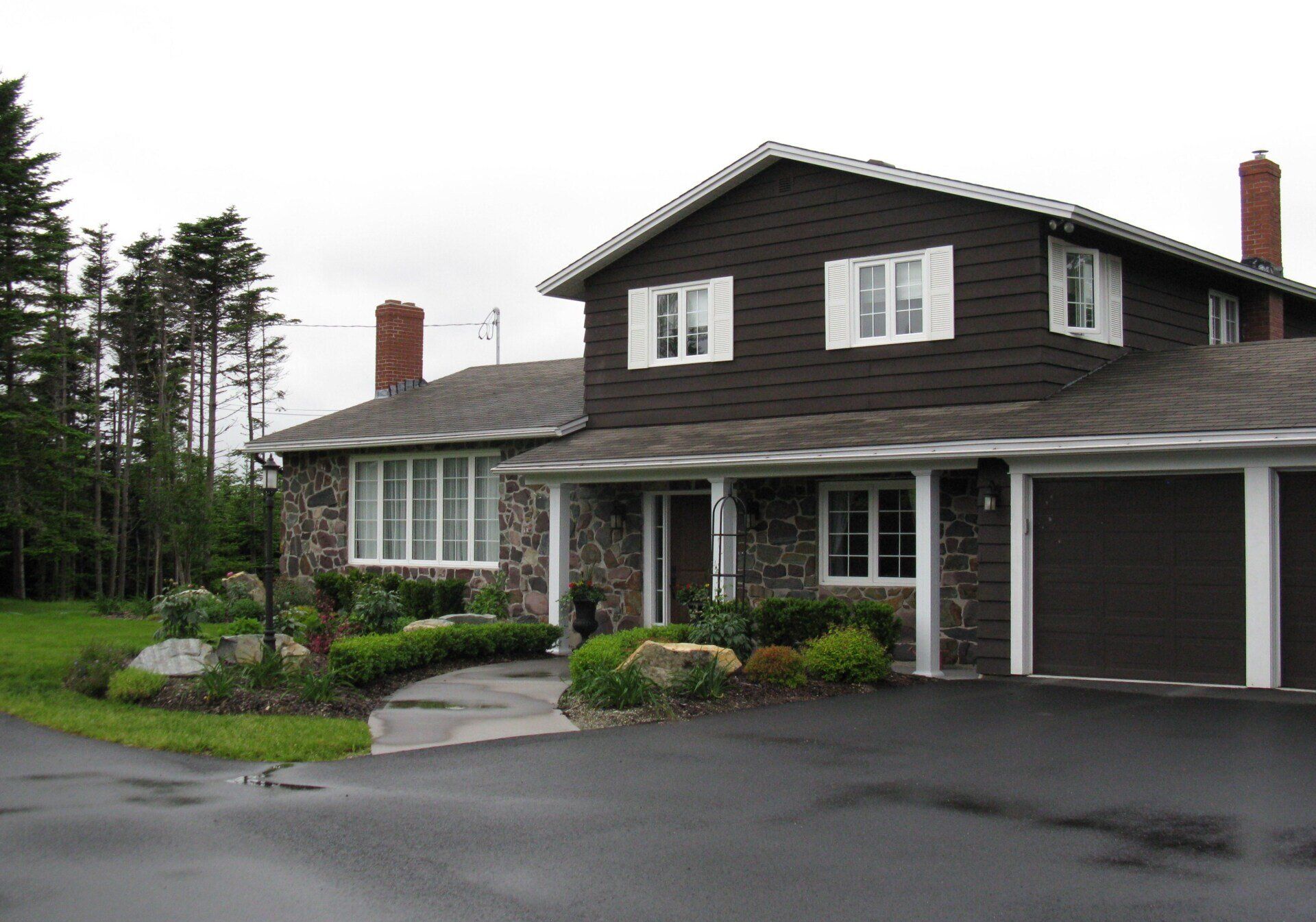 A large house with a garage and a driveway