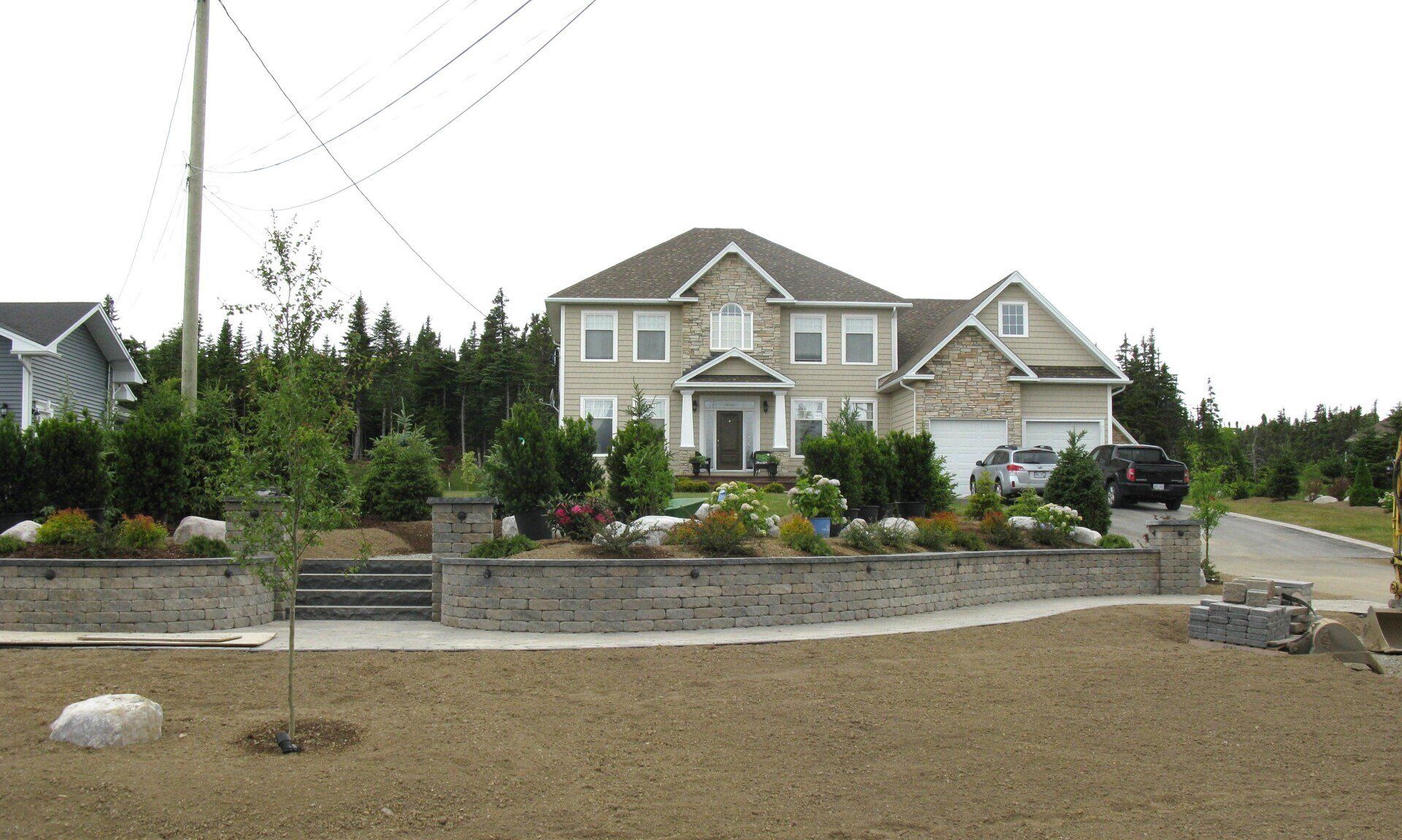 A large house sits in the middle of a residential area
