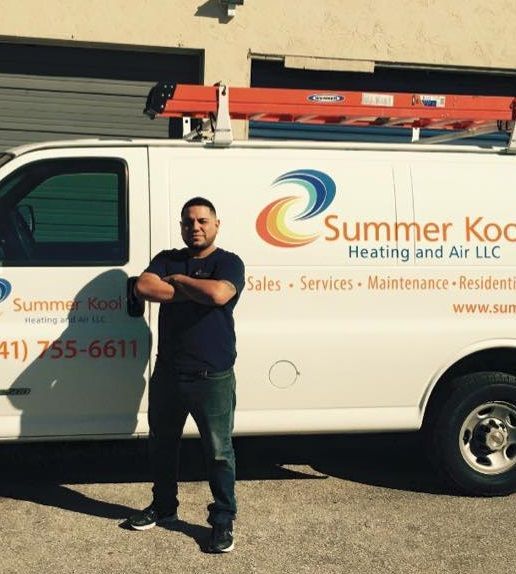 Man in front of a Summer Kock Heating and Air van
