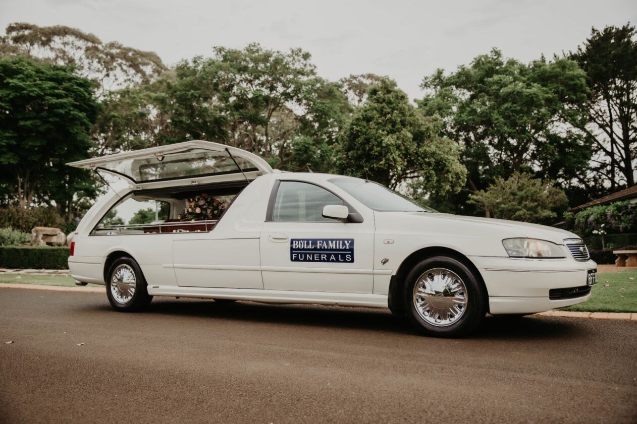 A Bouquet of Flowers With a Tag That Says Sincere Condolences — Bull Family Funerals in Inglewood, QLD