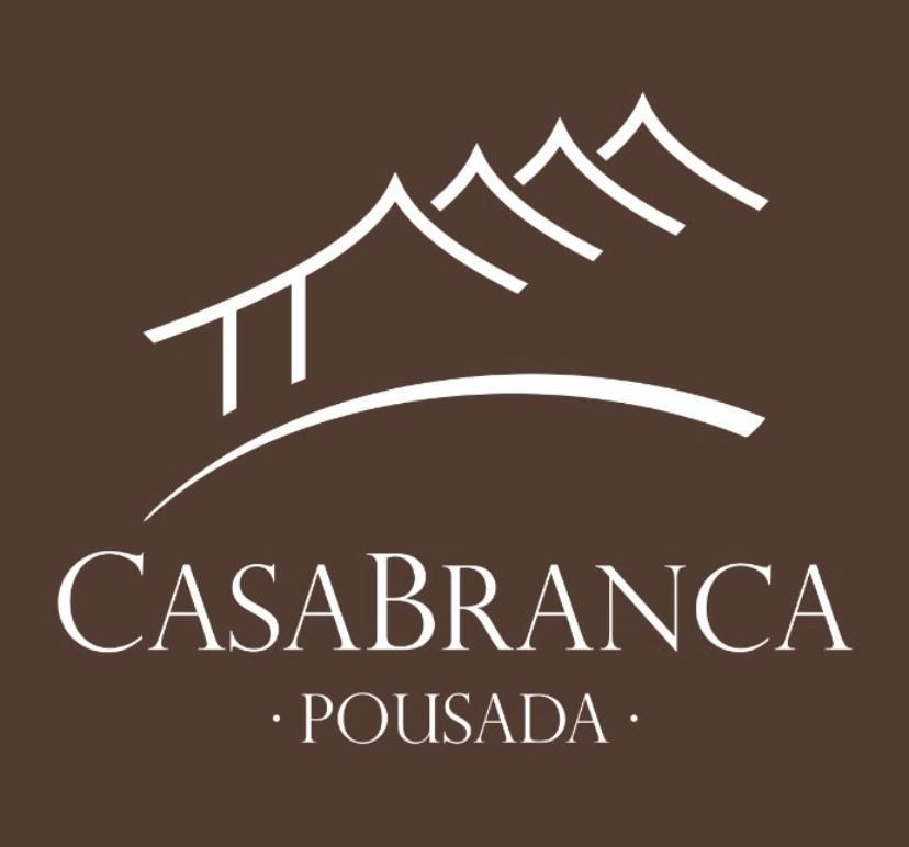 A brown and white logo for casabranca pousada