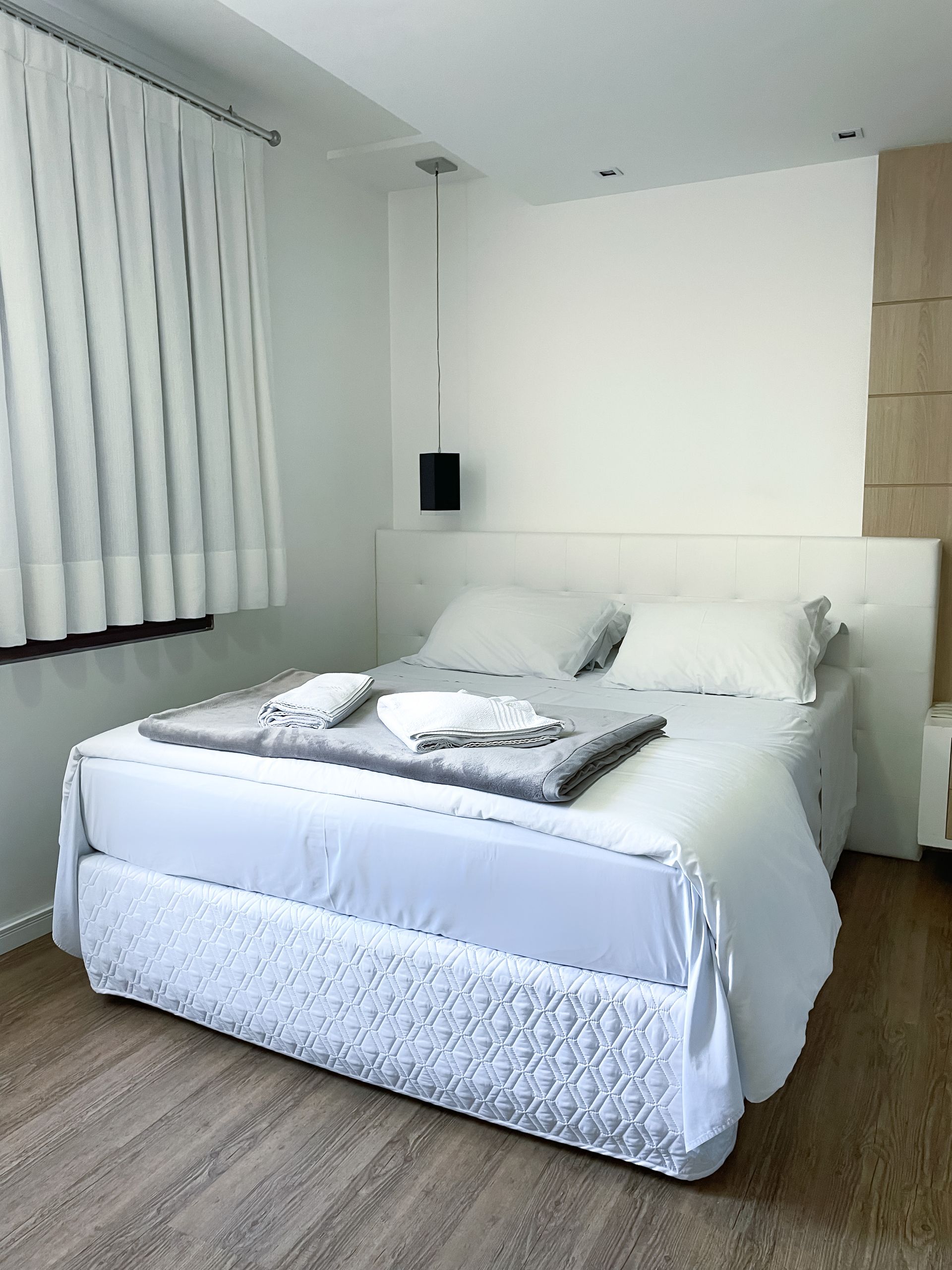 There is a large bed in the middle of the room.