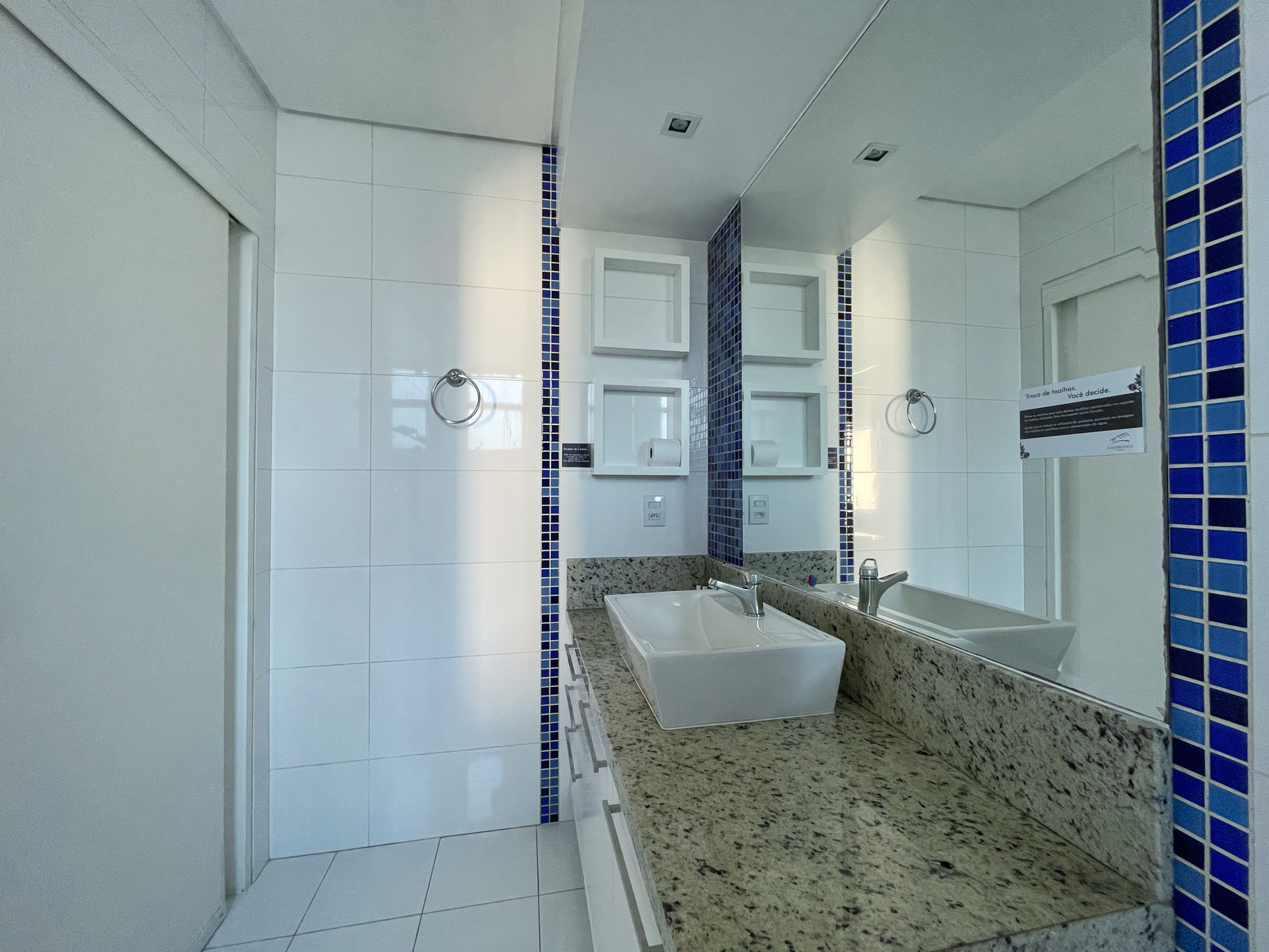 A bathroom with two sinks and a large mirror