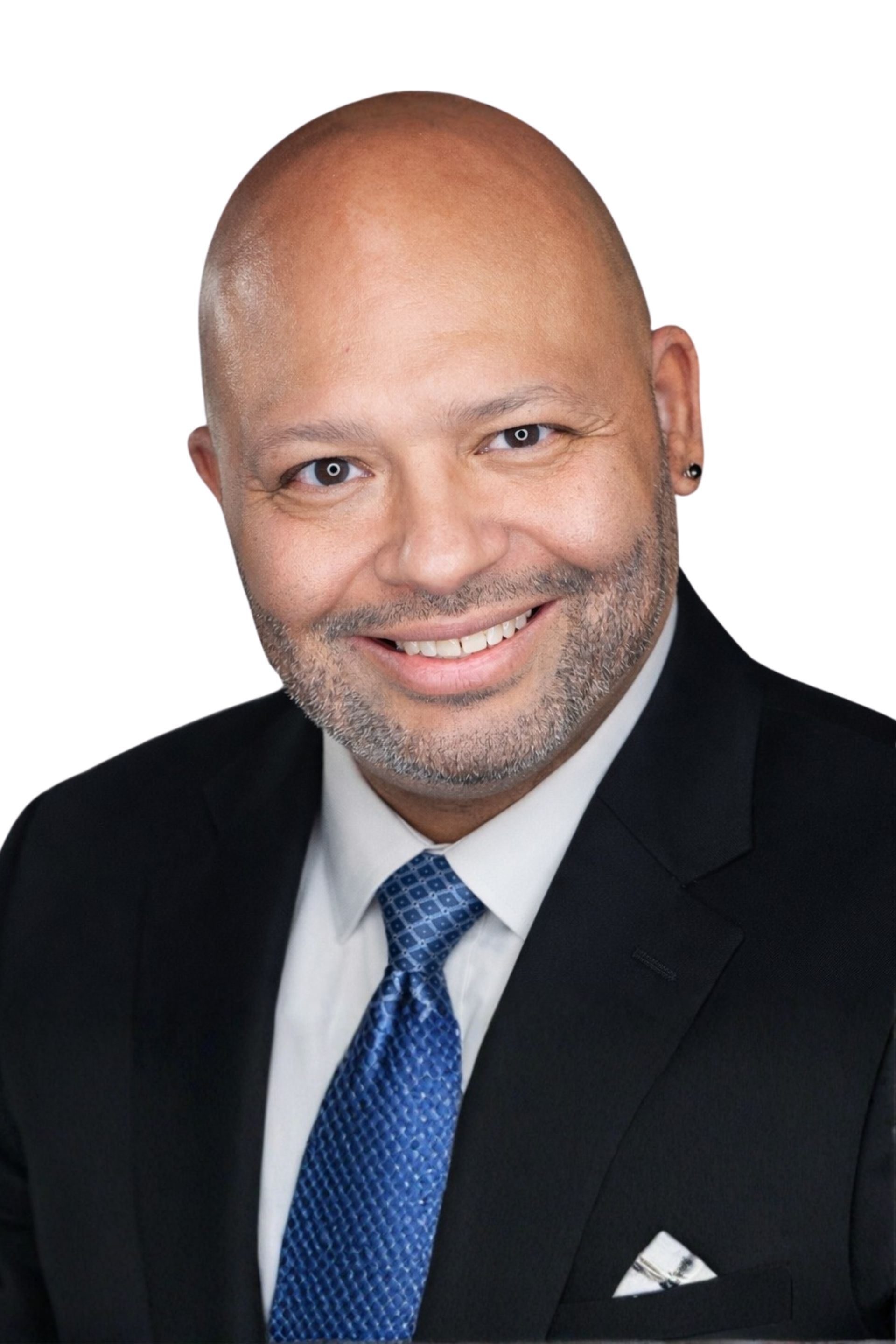 Smiling man in a black suit and blue tie against a white background