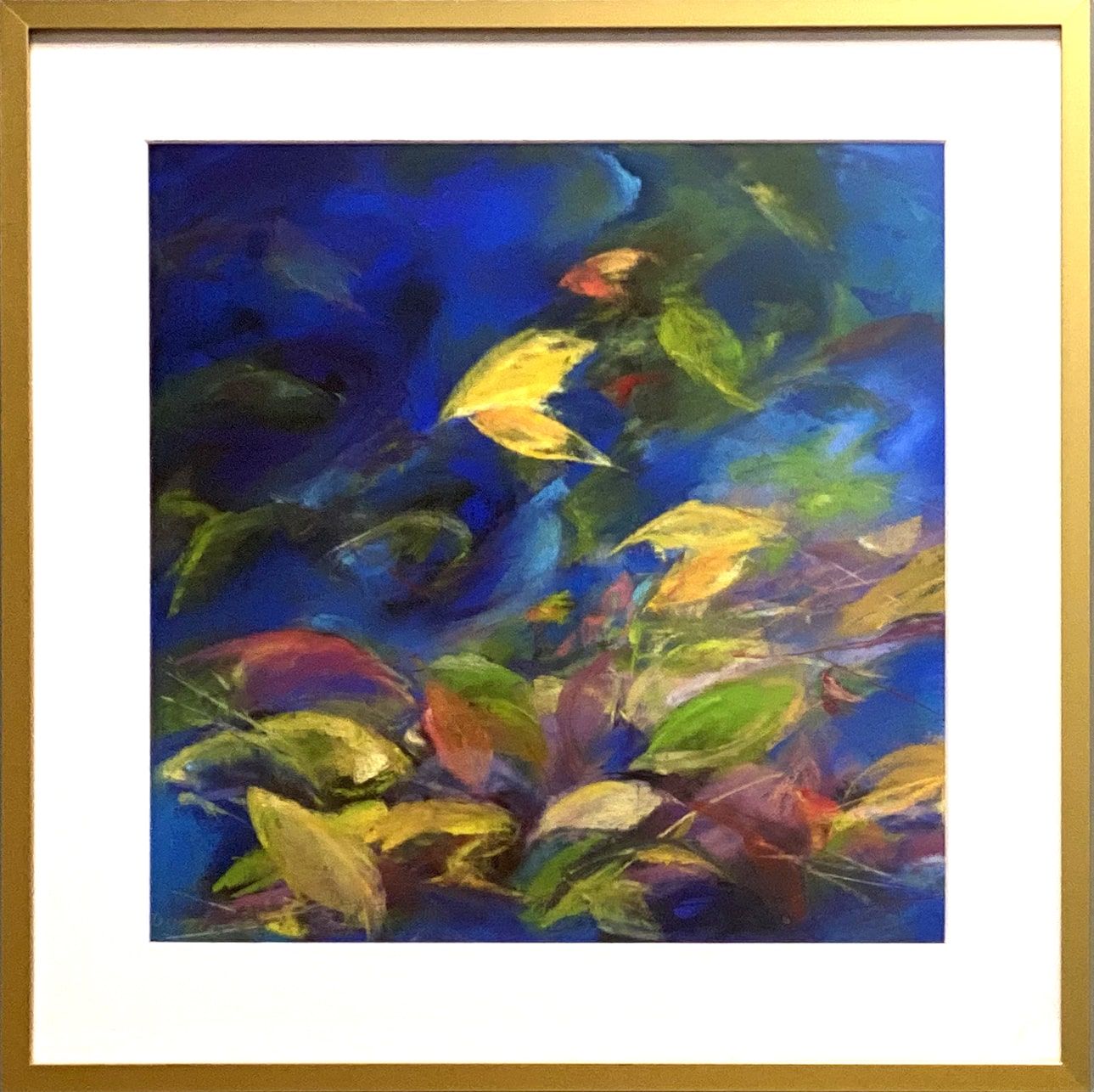 Abstract floral painting with blue, green, and yellow brushstrokes in a gold frame