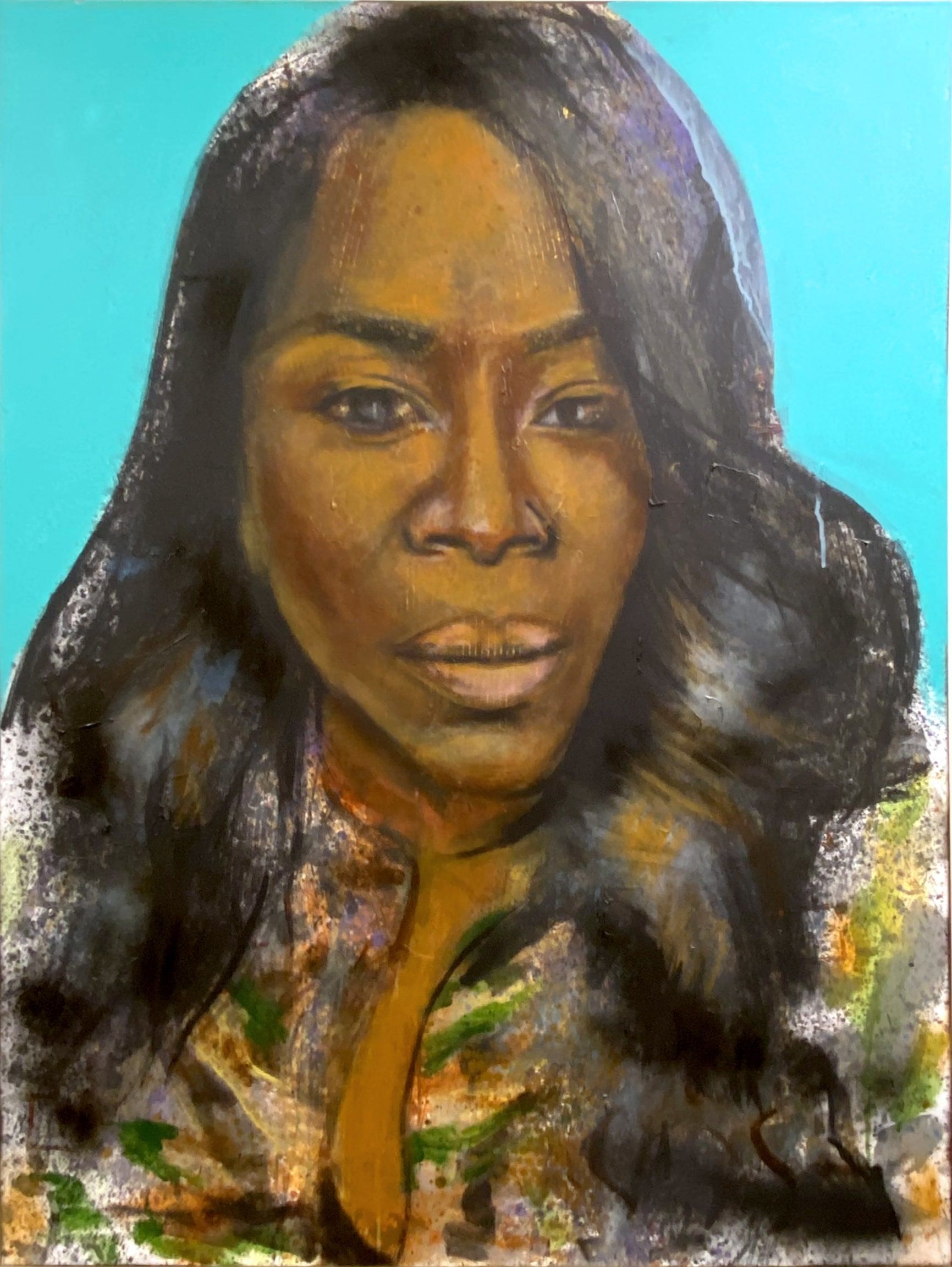 Portrait of a woman with long wavy dark hair against a bright blue background