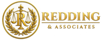 Gold “Redding & Associates” logo with laurel wreath and scales of justice icon