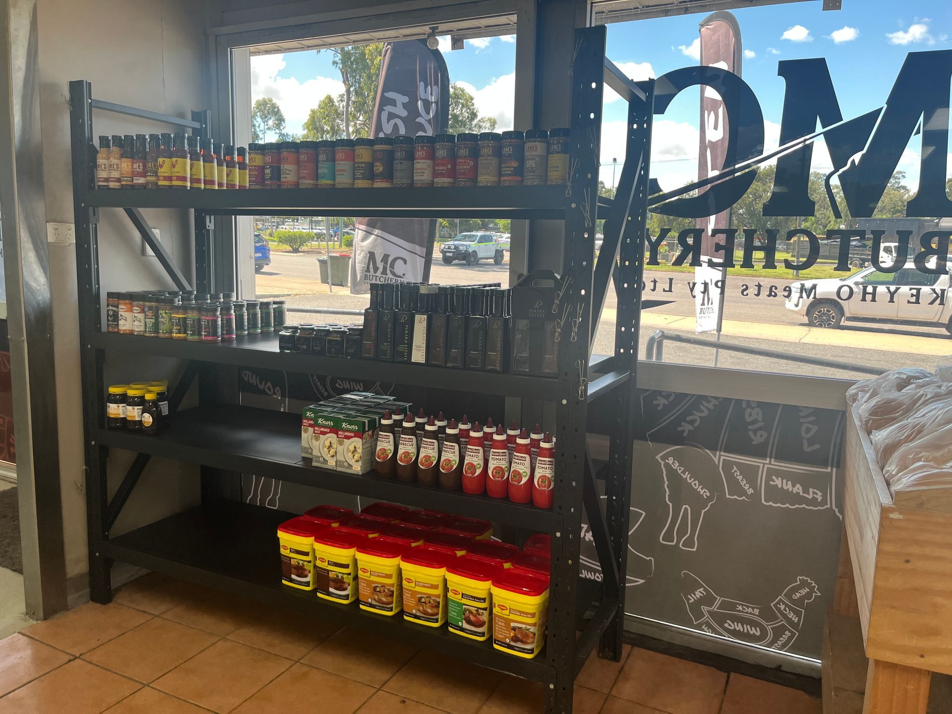 A Variety of Meats and Sausages Are Displayed on a Table — MC Butchery in Moranbah, QLD