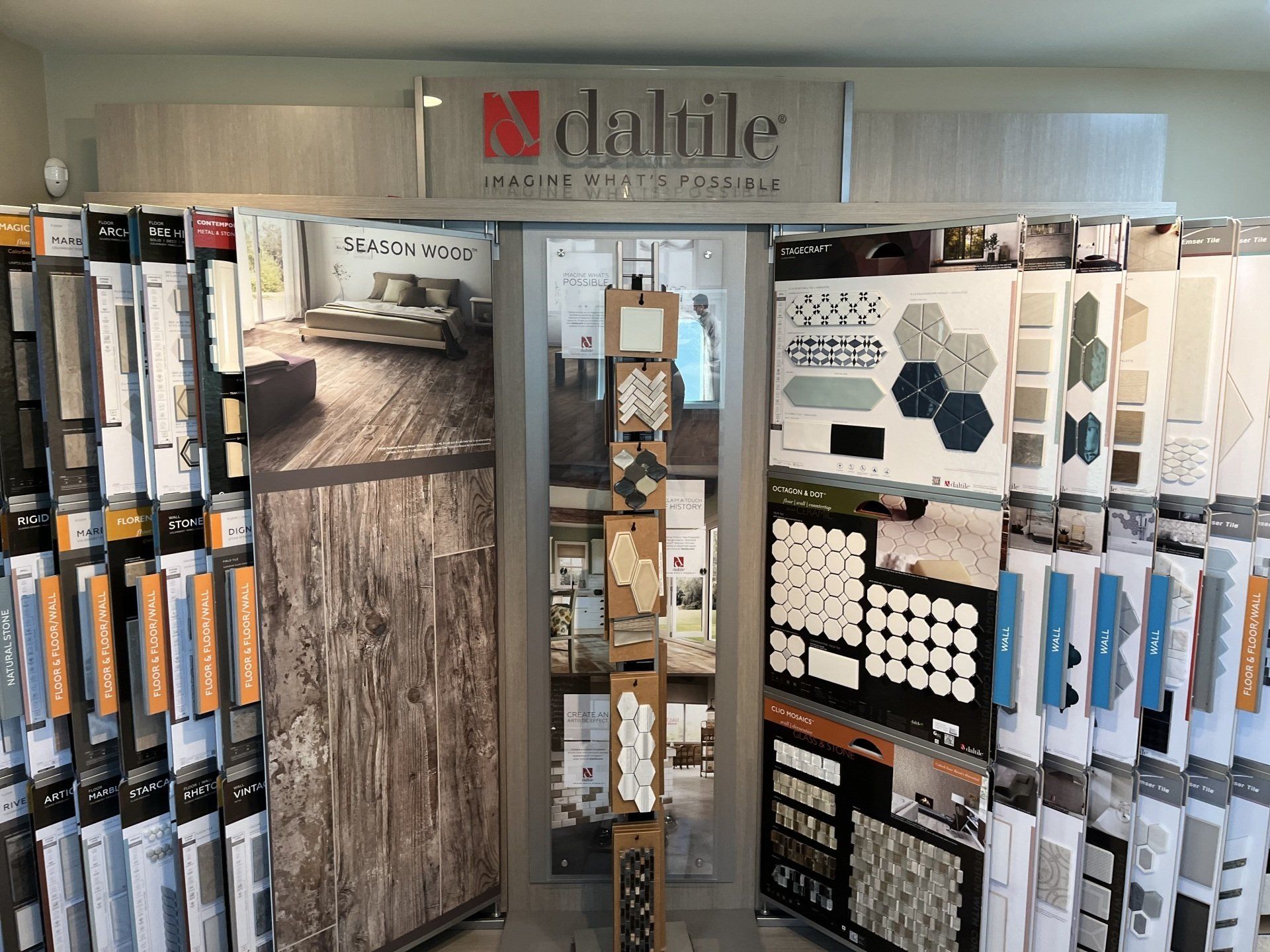 DalTile showroom display with tile samples, wall boards, and color swatches on a store display wall