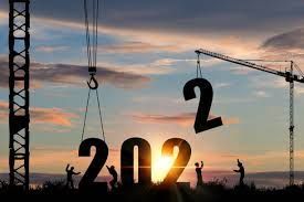 A construction crane is lifting the number 2022 into the air.