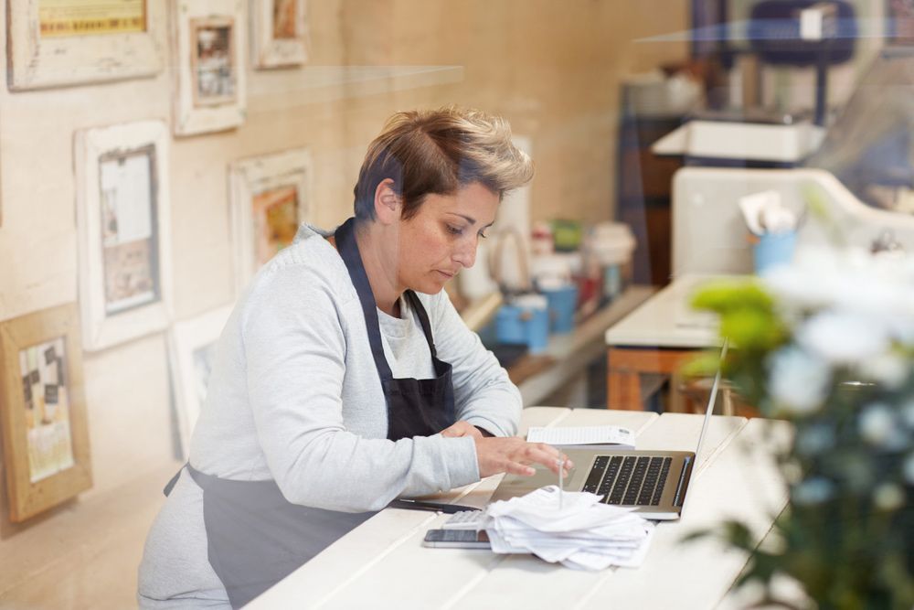 Business Owner Doing Taxes In Laptop — Accounting Services in Coffs Harbour, NSW