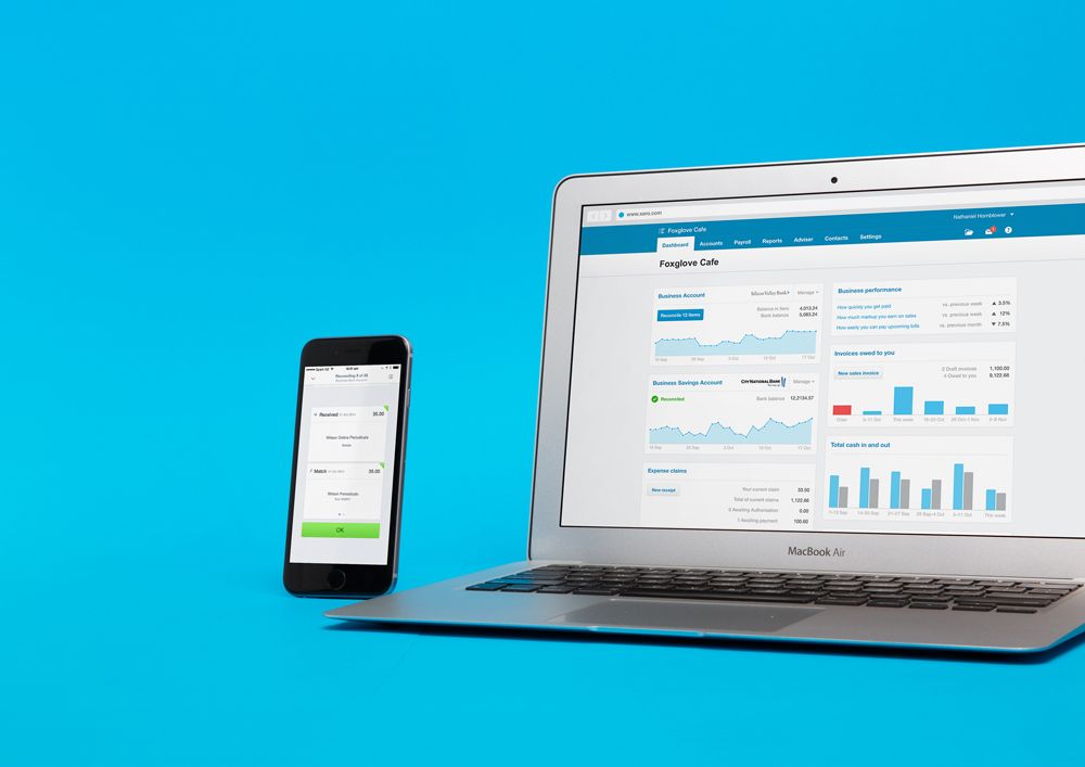 Laptop And Mobile Phone On Blue Background — Accounting Services in Coffs Harbour, NSW
