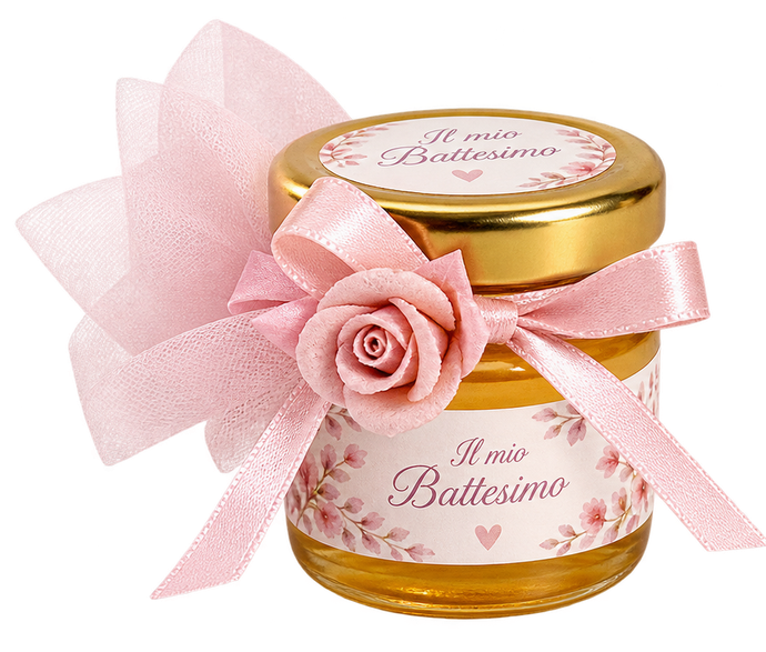 Barattolo rosa con la scritta "Mi Bautismo", coperchio dorato, nastro e decorazione a forma di rosa.
