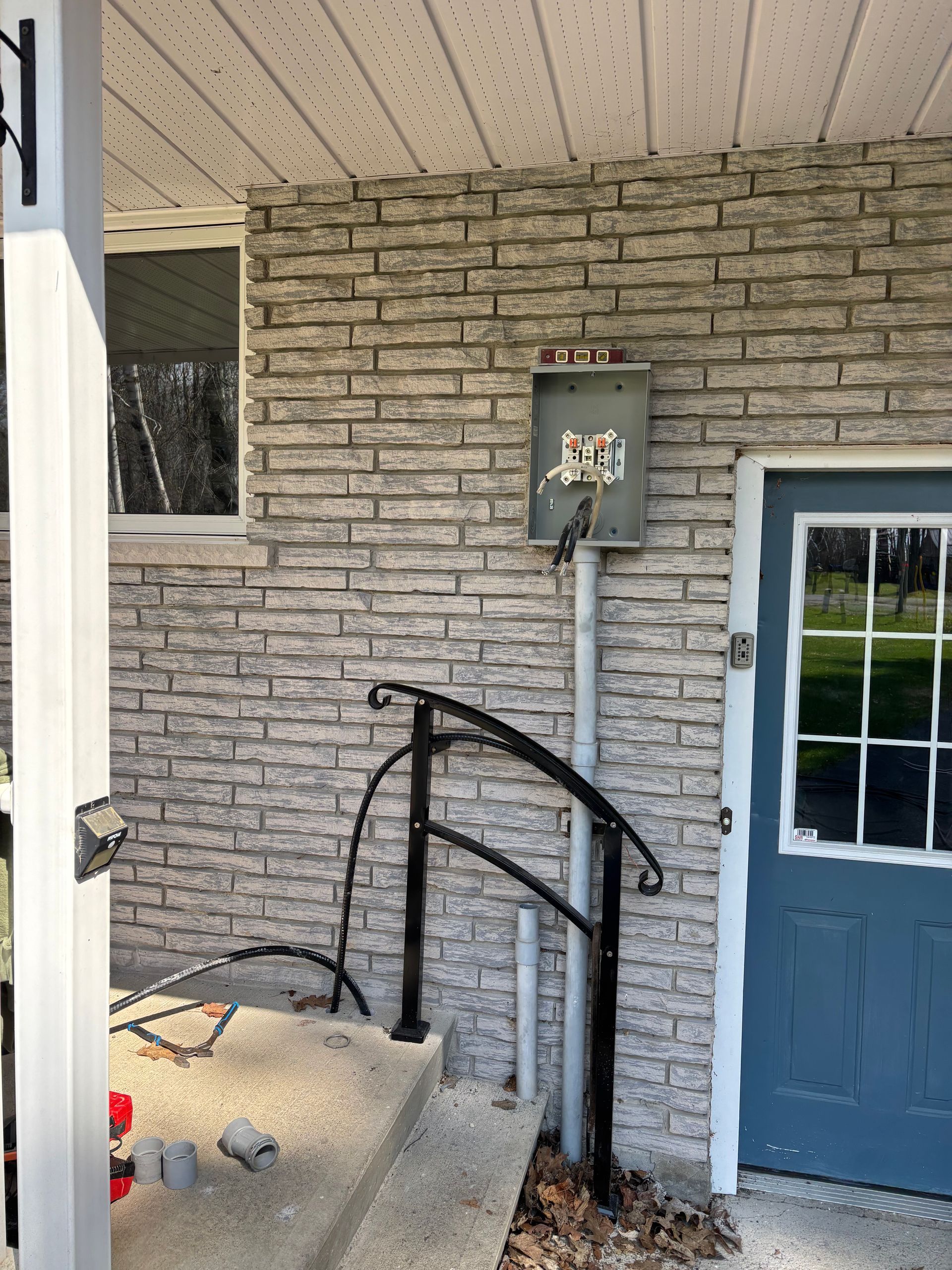Installed a new exterior meter base mounted on the brick wall adjacent to the entrance, ensuring it is level and securely fastened. Electrical service conductors have been routed through rigid conduit, with additional conduit stub-ups provided for the underground service connection. Installation is ready for PCH Electrical inspection and utility service completion pending final conductor terminations and energization.