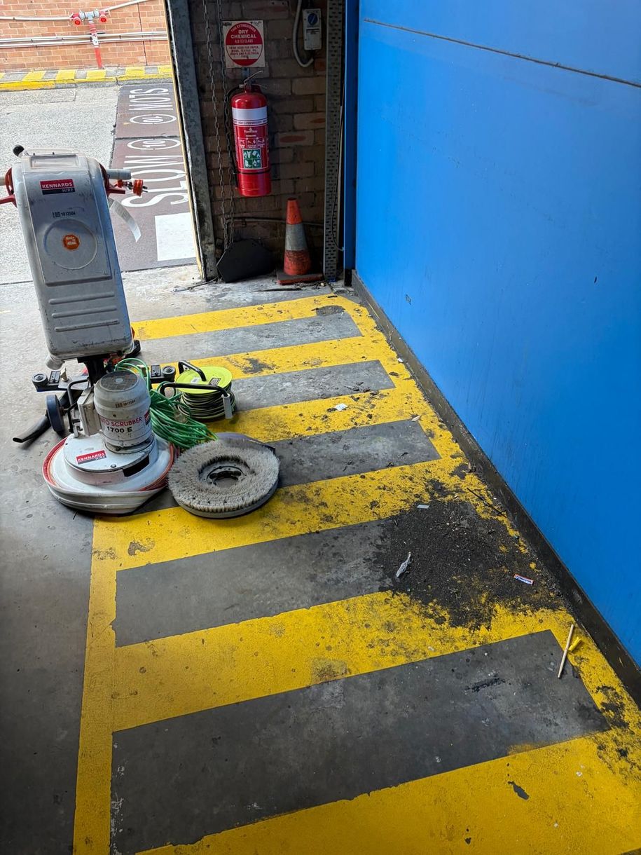 Emergency cleaning crew in hi-vis PPE responding to industrial spill