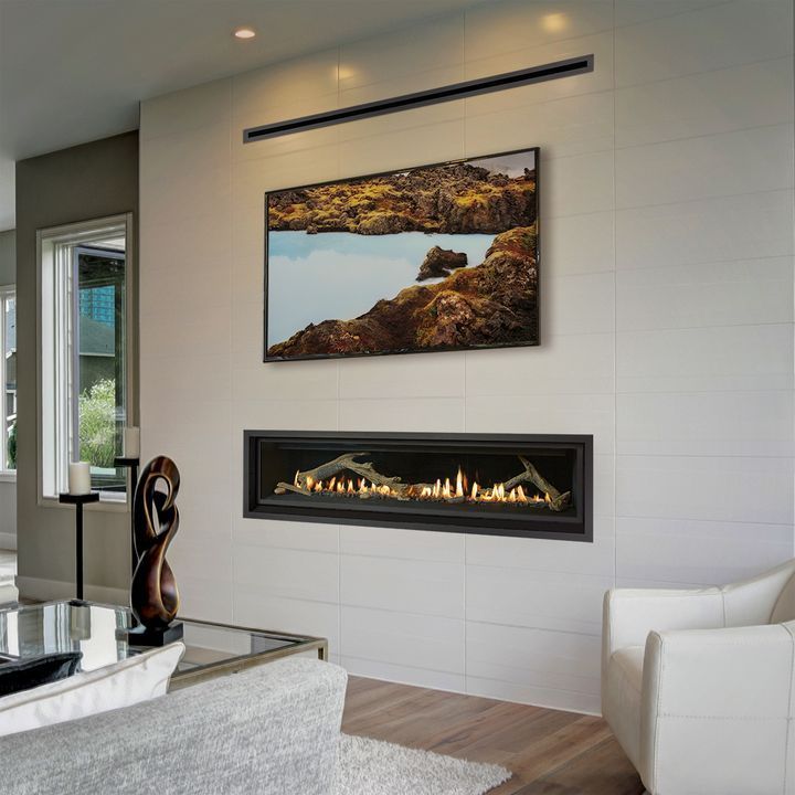 Modern living room with fireplace and television on a white wall.