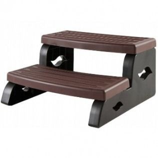 Two-step brown and black plastic spa step with ridged steps and decorative cutouts on the sides.
