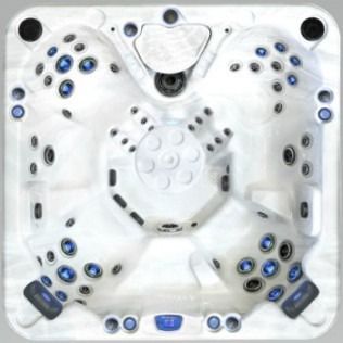 Overhead view of a white hot tub interior with blue and black jets and several seating areas.