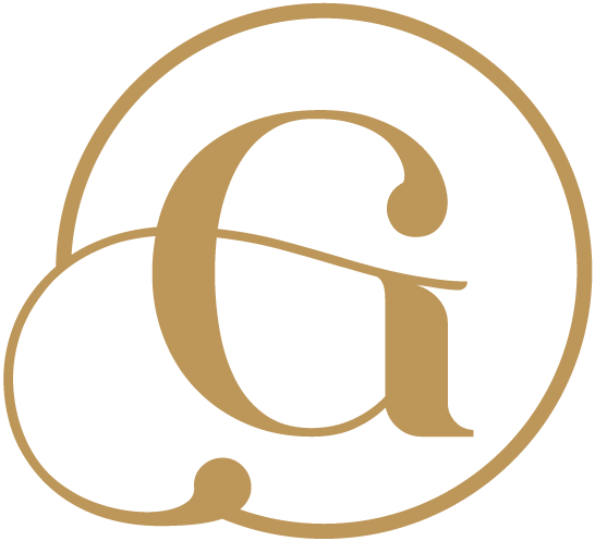 A gold-colored, stylized letter 'G' encased within a continuous, flowing circular line on a white background.