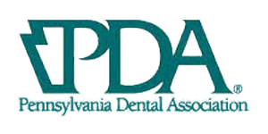 Logo of the Pennsylvania Dental Association, featuring the letters PDA in dark green, with a map outline of Pennsylvania.