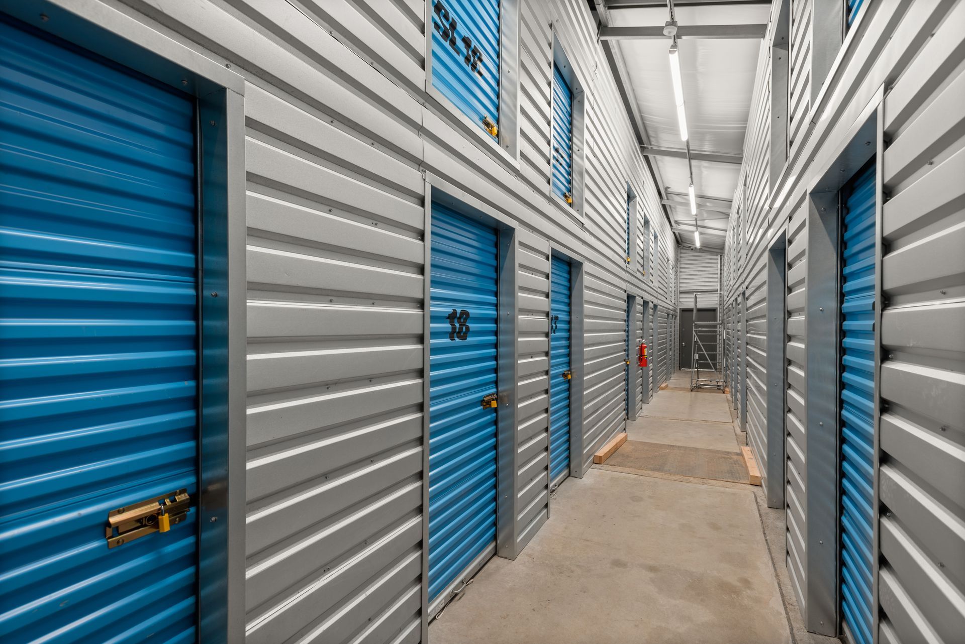 Interior view of modern Aspen storage units at Snowmass Self Storage facility with secure roll-up doors