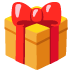 Scatola regalo rossa con nastro e fiocco gialli.