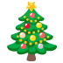 Albero di Natale decorato con ornamenti colorati, puntale a stella, luci e regali alla base.