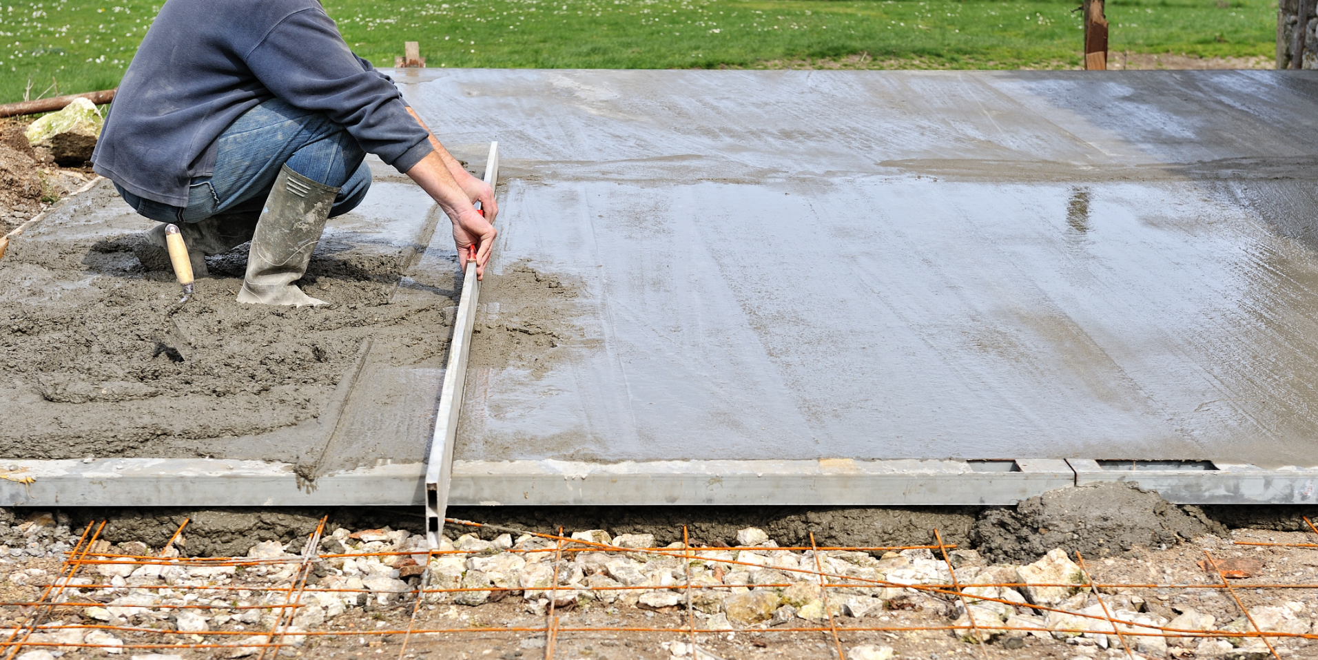 Picture of a nice concrete patio.  The patio is stamped concrete and connects to an outdoor fireplace.