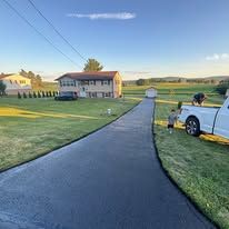 Commercial paving crew resurfacing a parking lot