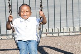 kid on swing