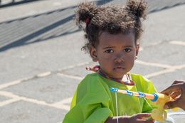 little girl wearing green shirt