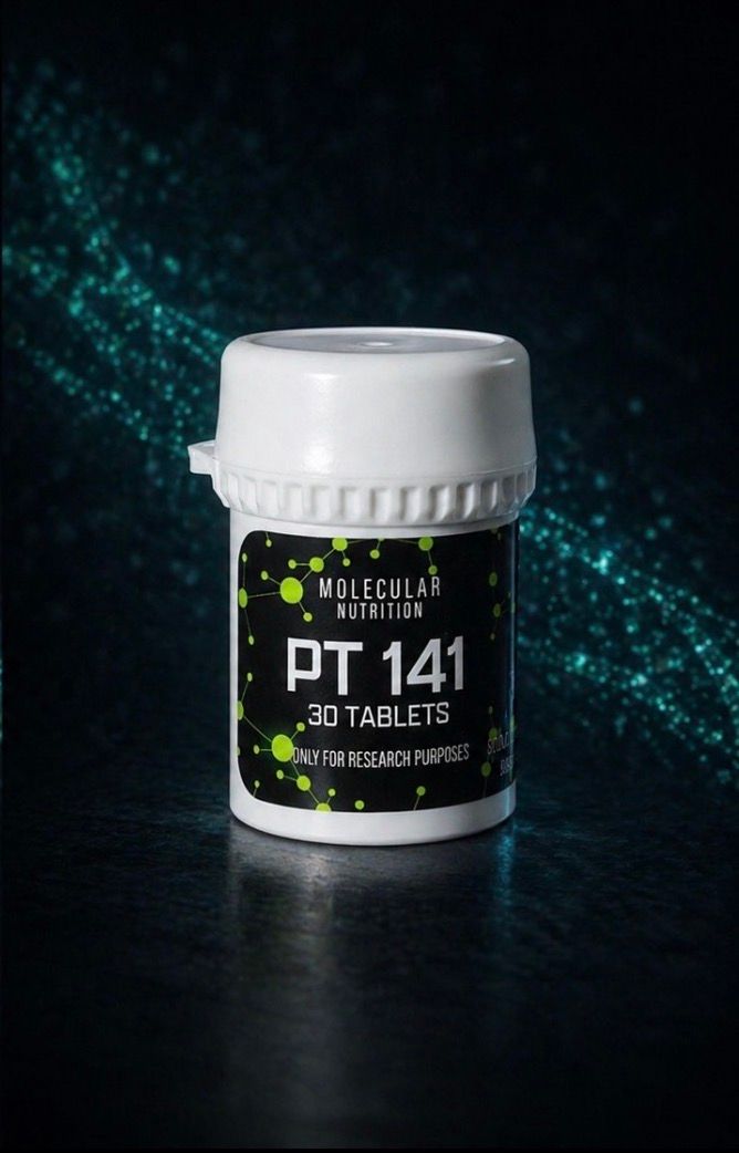 Small white-lidded jar labeled “PT 141” on a dark, teal-speckled background
