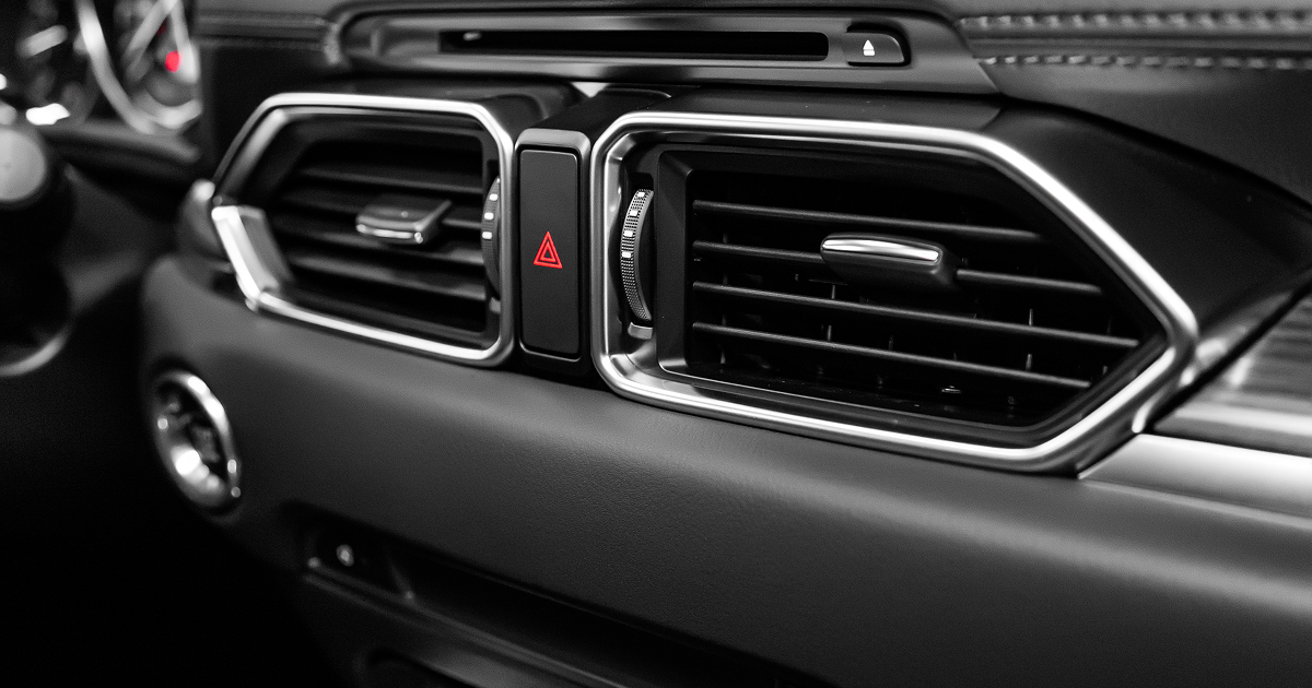 Car dashboard center vents and hazard button in black and silver trim | Quality Auto Repair Tire & Auto Sales