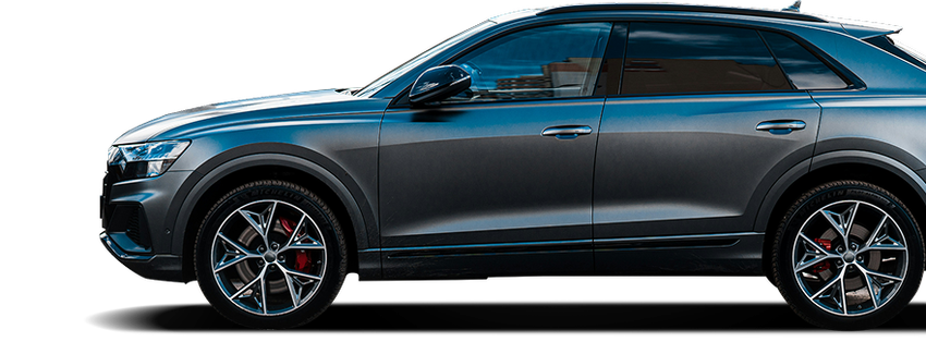 Side view of a metallic gray luxury SUV with black trim and red brake calipers | Quality Auto Repair Tire & Auto Sales