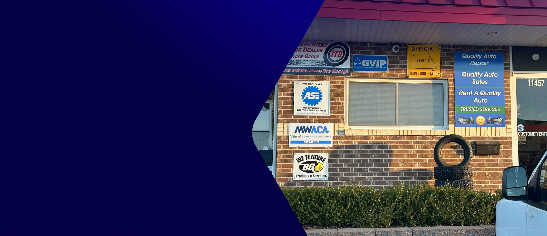 Brick storefront with blue awning and menu boards, partially covered by a large blue graphic shape | Quality Auto Repair Tire & Auto Sales