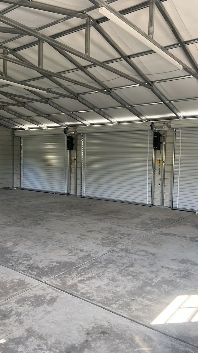 three bay metal roll up garage door installation