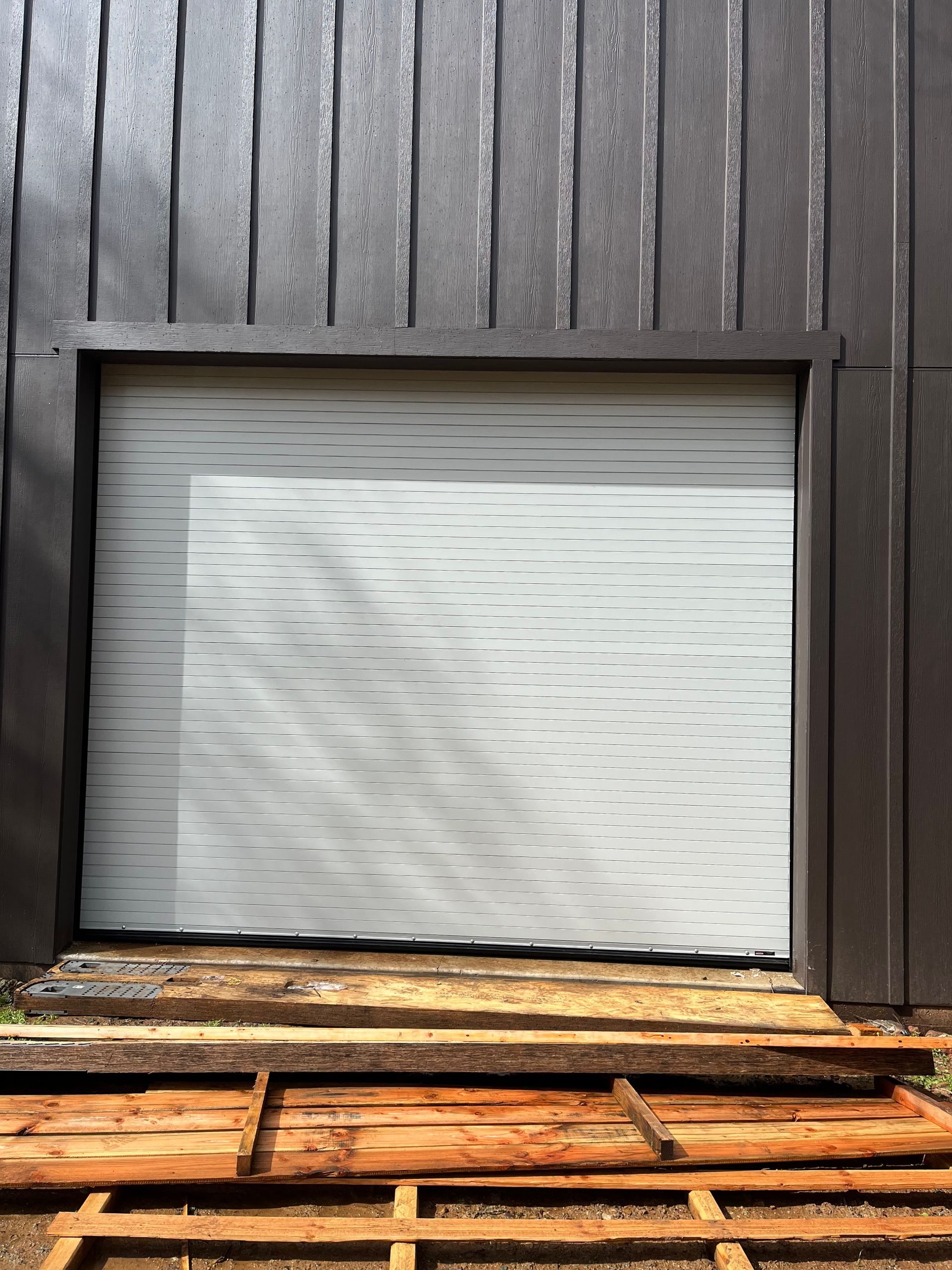 Metal garage door for entry