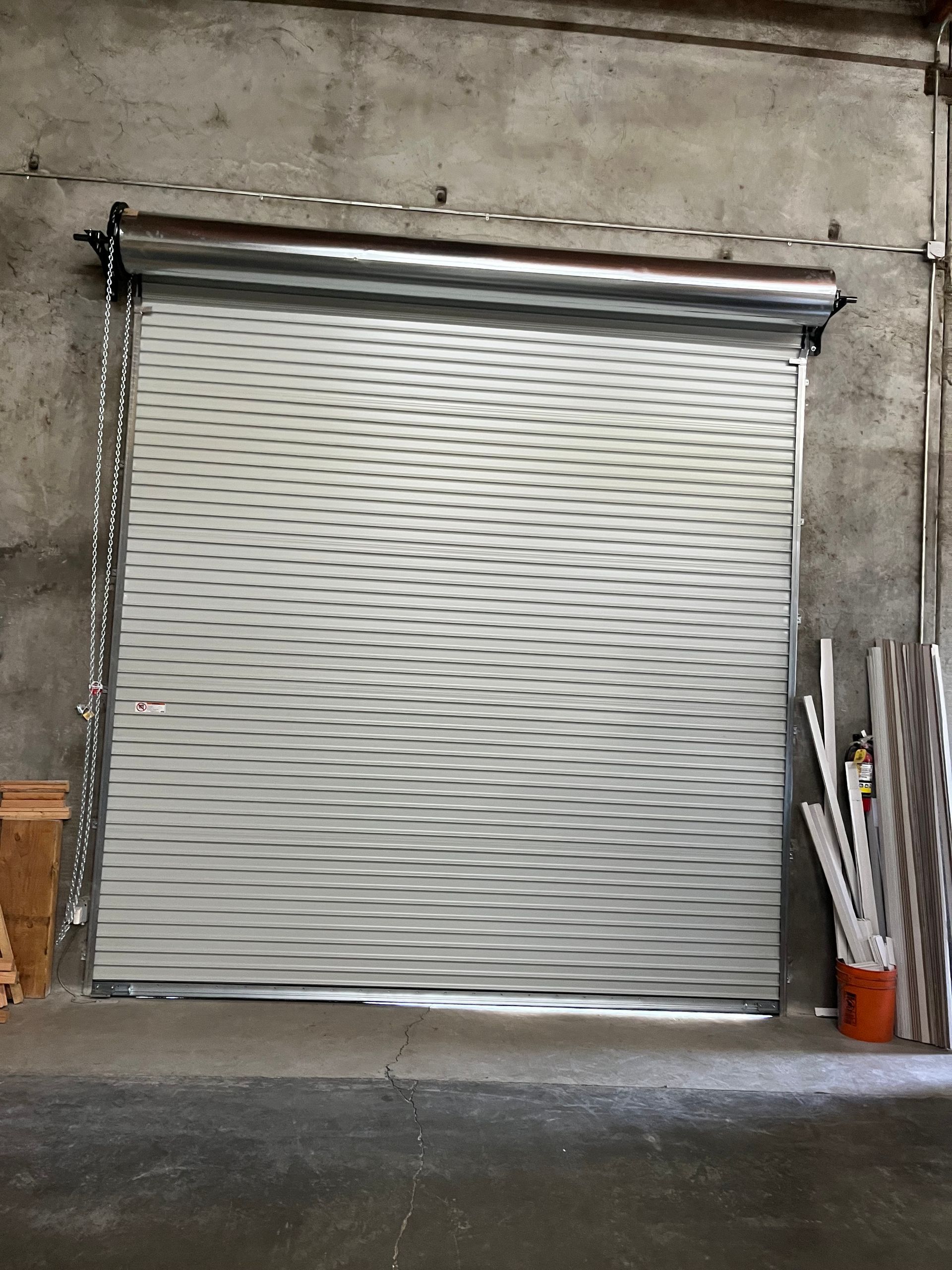 Metal commercial garage door installation