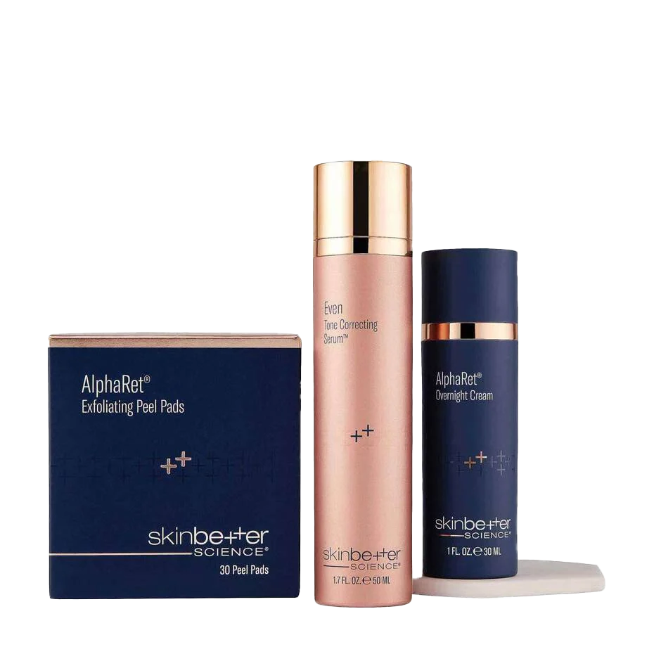 Skinbetter Science skincare products: peel pads, face cream, and overnight cream, in blue and rose gold packaging.