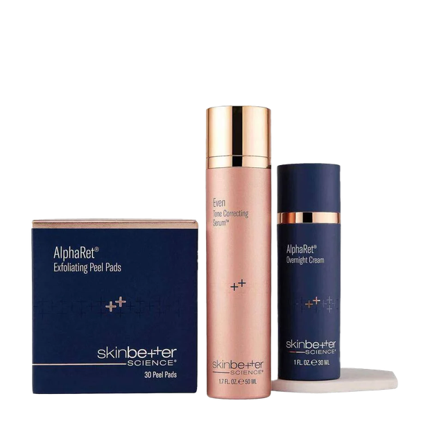 Skinbetter Science skincare products: peel pads, face cream, and overnight cream, in blue and rose gold packaging.