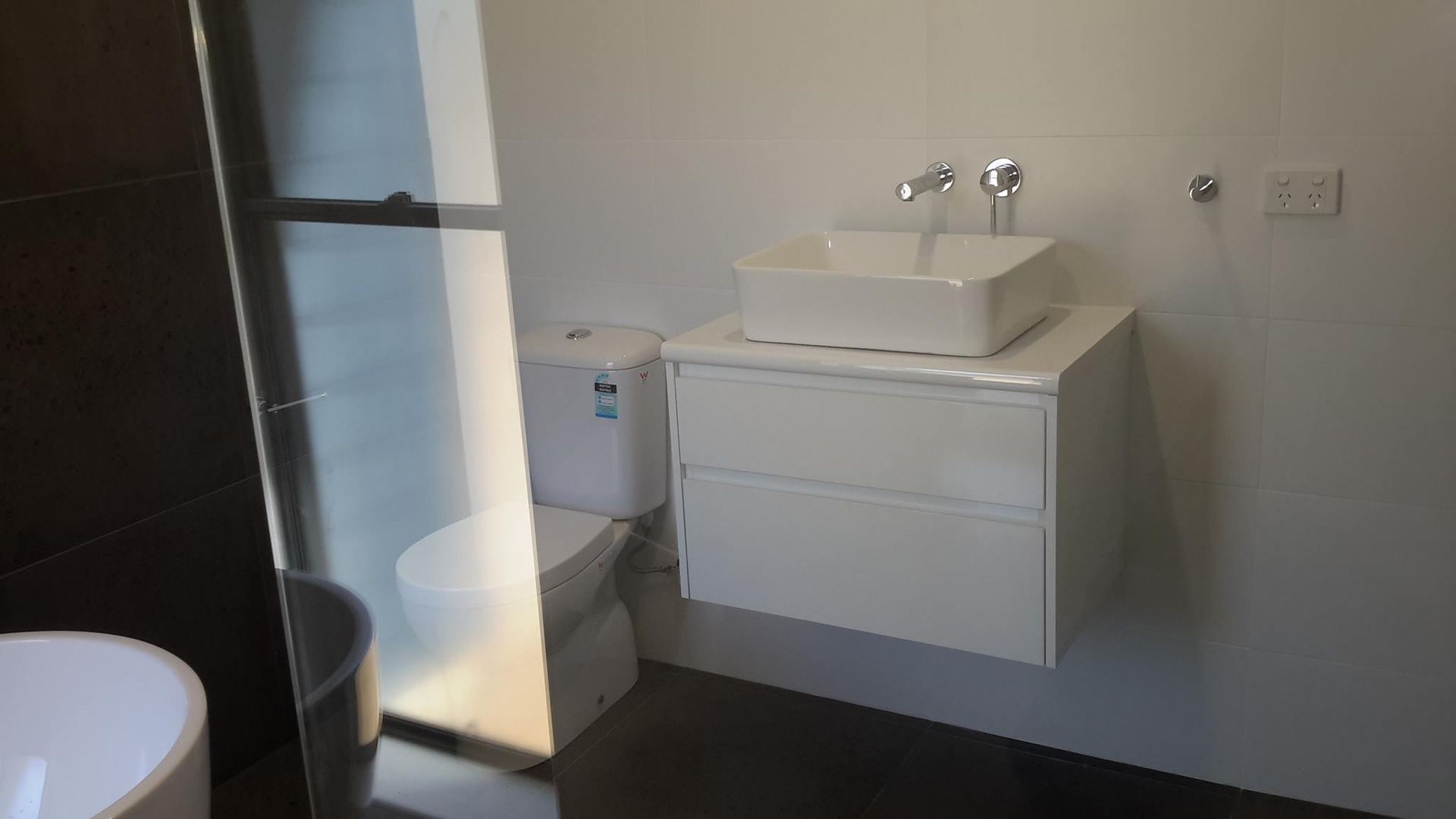 Stylish Bathroom Interior With Modern Washing Machine — Laundry & Bathroom Vanities in Nambucca Heads, NSW