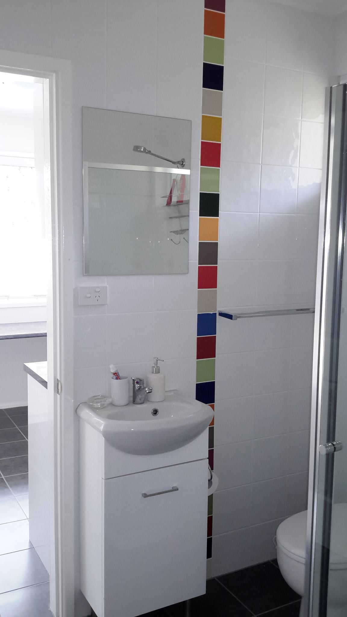 Colourful Tiles, Washbasin And Mirror — Custom Cabinetry & Kitchen Renovations in Nambucca Heads, NSW