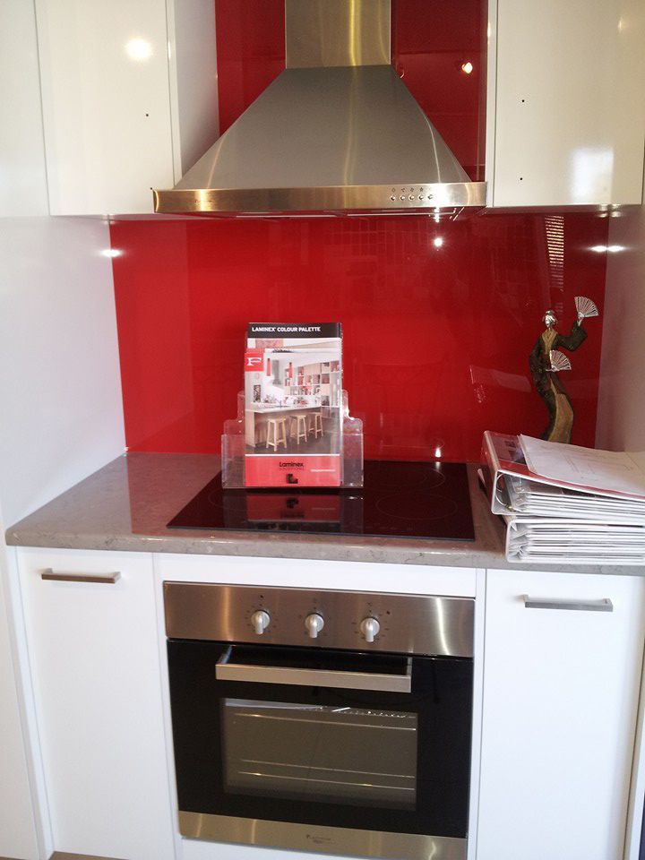 Red And White Kitchen Room, Magazines And Gas Range — Custom Cabinetry & Kitchen Renovations in Nambucca Heads, NSW