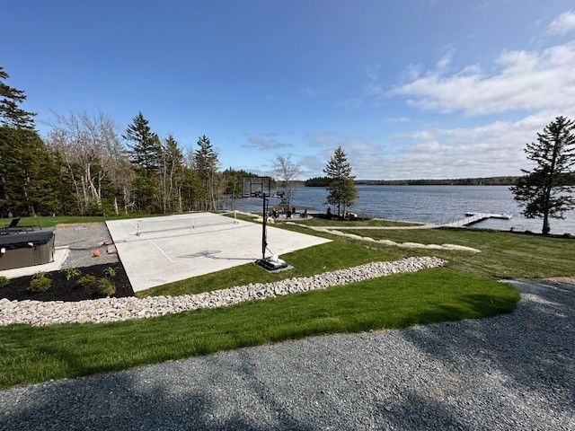 a view of a lake from the backyard of a house .